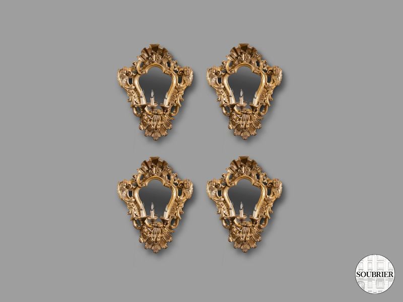 Quatre grandes appliques miroir