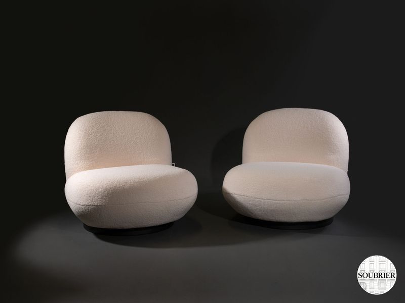 Two modern white armchairs